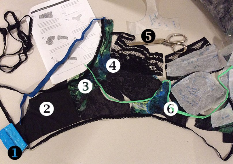 Laying out my bra pieces, along with straps and other notions, helps me visualize the finished bra.